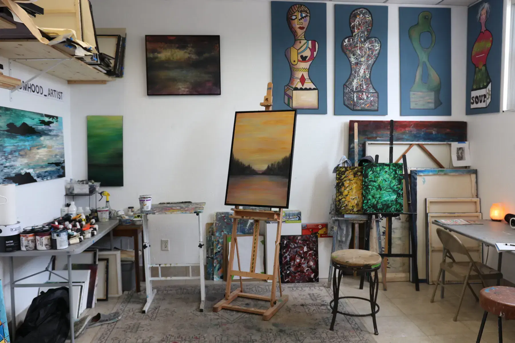 studio space with Dennis Hood Art in background.